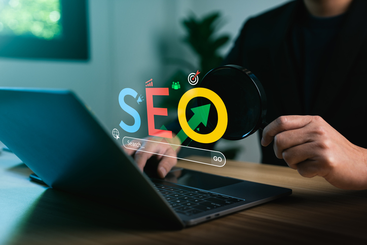 SEO search graphic above a laptop